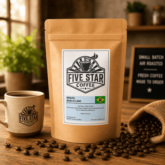 Five Star Coffee Brazil Bob-O-Link coffee bag on a rustic wooden table with coffee beans, featuring a medium roast with maple, blueberry, rich aroma, and a sweet aftertaste.