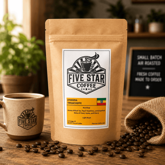 Five Star Coffee Ethiopia Yirgacheffe coffee bag on a warm wooden table with coffee beans, featuring a light roast with black tea aroma, peach sweetness, grapefruit, floral, honey, and cherry notes.
